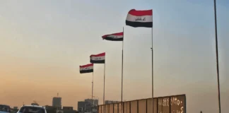 Iraq Raises National Flag Over Baghdad Bridges After Removing Armed Group Banners in Dora District
