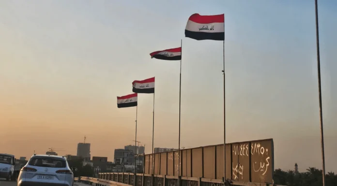 Iraq Raises National Flag Over Baghdad Bridges After Removing Armed Group Banners in Dora District